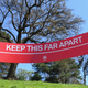 A sign reading ‘Keep This Far Apart’, to remind people of social distancing, is seen in a park on April 15, 2020 in New York City.